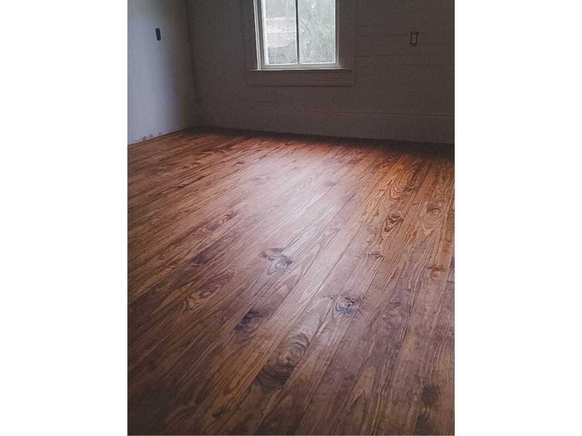 Dark tung oil finish on new pine floors.