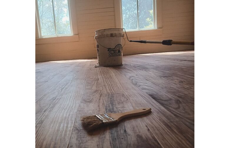 Dark tung oil finish application on new pine floors.